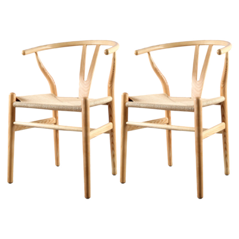 Silla de respaldo moderna de reposabrazos con patas de madera para el comedor