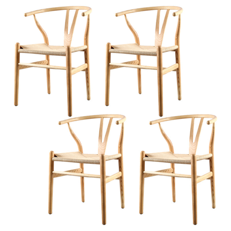 Silla de respaldo moderna de reposabrazos con patas de madera para el comedor