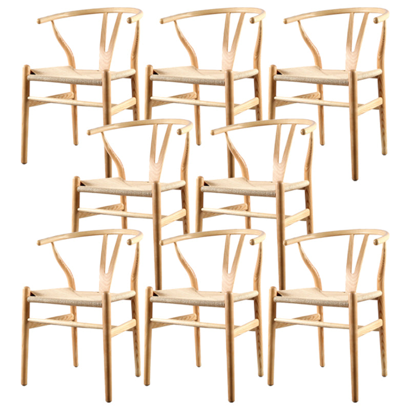 Silla de respaldo moderna de reposabrazos con patas de madera para el comedor