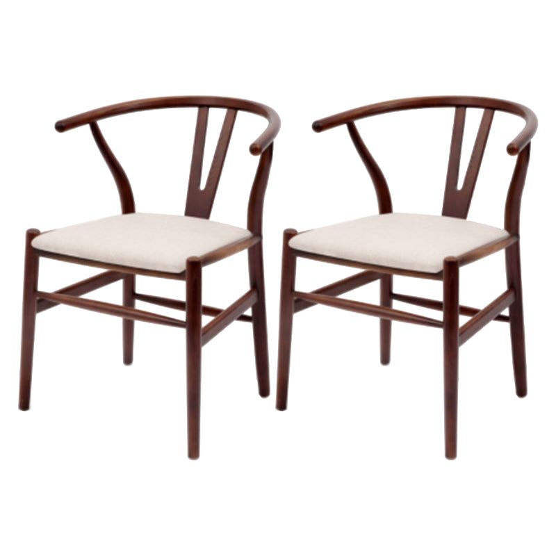 Silla de respaldo moderna de reposabrazos con patas de madera para el comedor