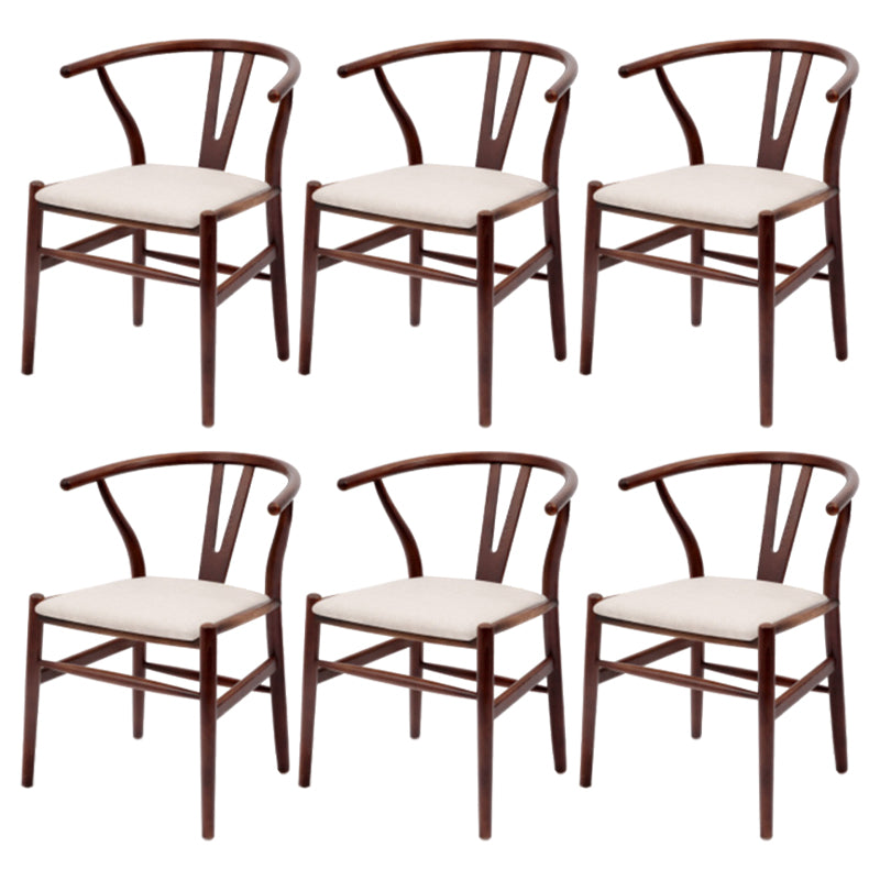 Silla de respaldo moderna de reposabrazos con patas de madera para el comedor