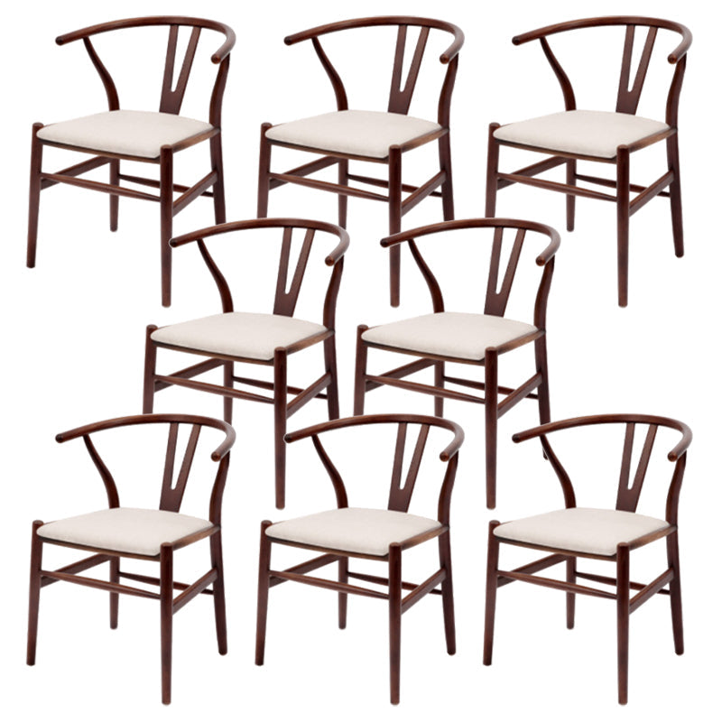 Silla de respaldo moderna de reposabrazos con patas de madera para el comedor