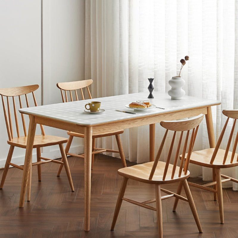 Moderne massief houten poten eettafel met rechthoekig stenen blad