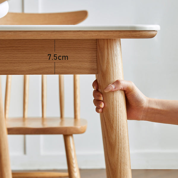 Moderne massief houten poten eettafel met rechthoekig stenen blad