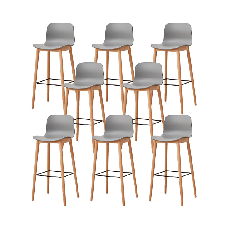 Contemporary Plastic Armless Bar Stools with Solid Wood Base