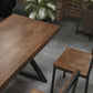 Mesa de comedor rectangular de madera maciza de estilo industrial con patas de hierro de pedestal doble