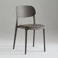 Silla de plástico de silla lateral de apilamiento interior moderno con tapizado