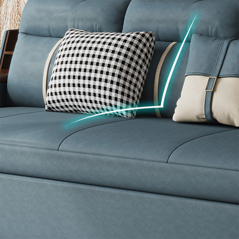 Canapé-lit bleu scandinave avec rangement et coussin en arrière