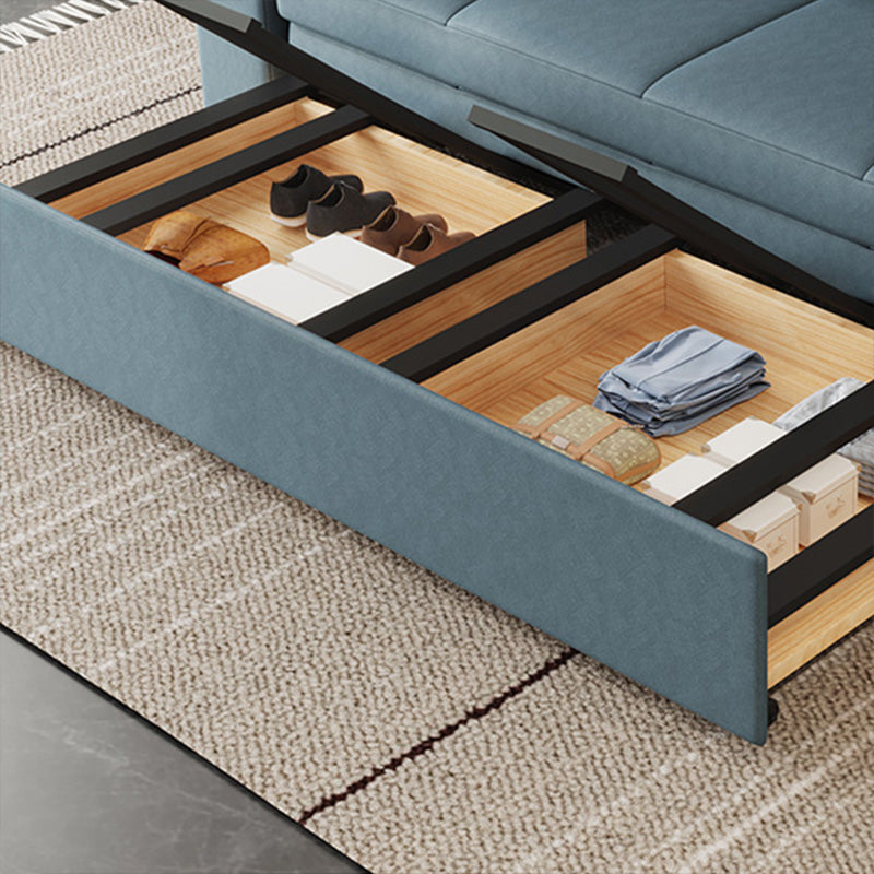Canapé-lit bleu scandinave avec rangement et coussin en arrière