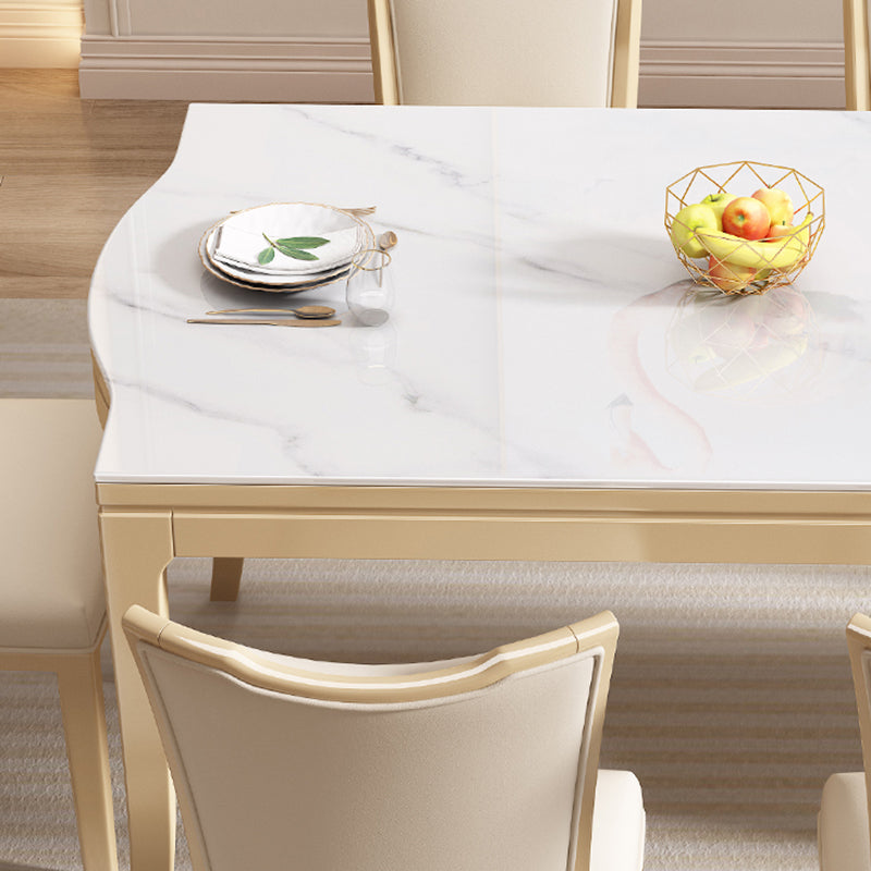 Table à manger moderne en pierre blanche avec pieds en bois massif pour le salon
