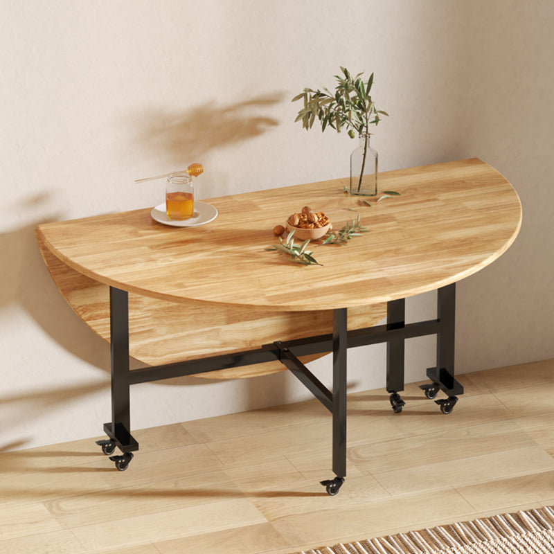 Mesa de comedor redonda de madera maciza de estilo moderno con hojas abatibles en color natural