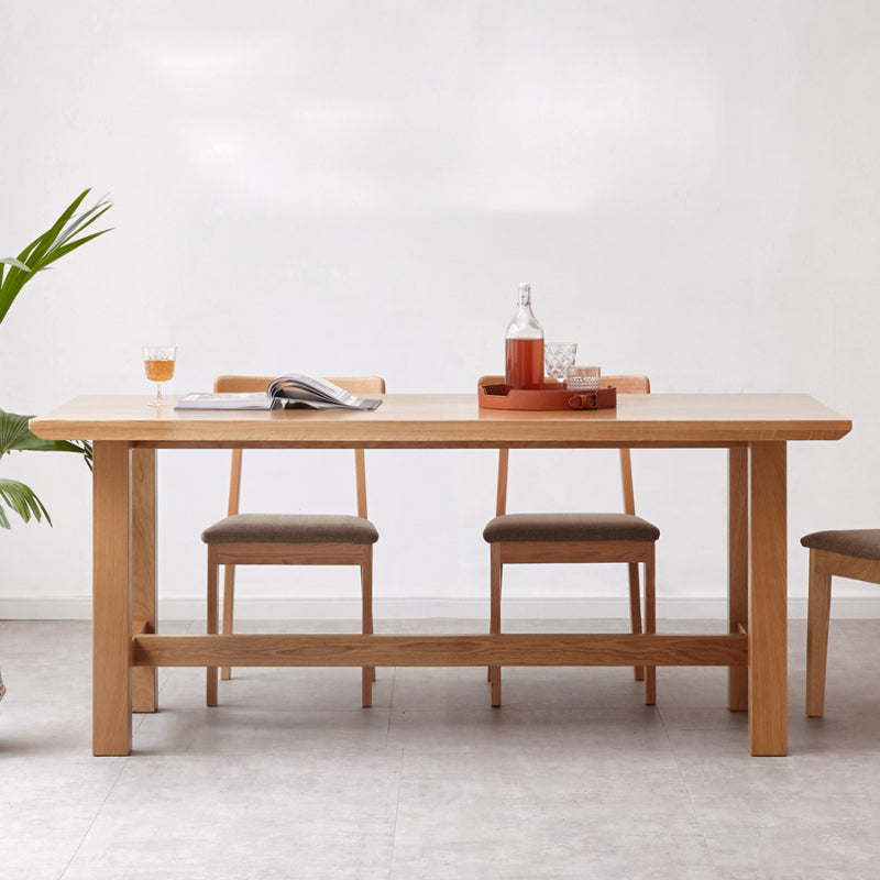 Mesa de comedor rectangular de madera maciza de color natural con base de caballete