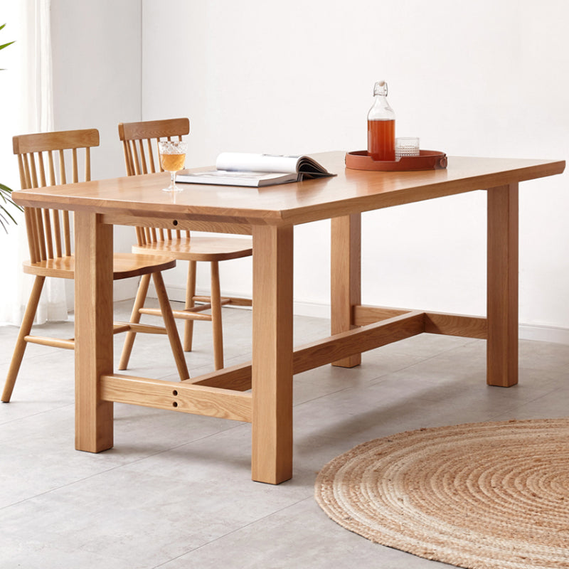 Mesa de comedor rectangular de madera maciza de color natural con base de caballete