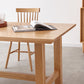 Mesa de comedor rectangular de madera maciza de color natural con base de caballete