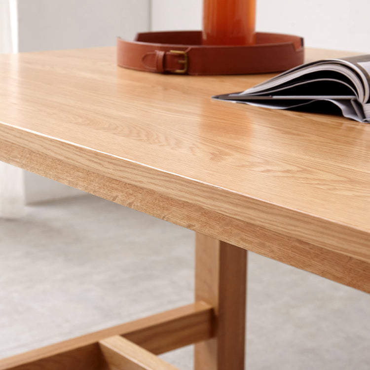 Mesa de comedor rectangular de madera maciza de color natural con base de caballete