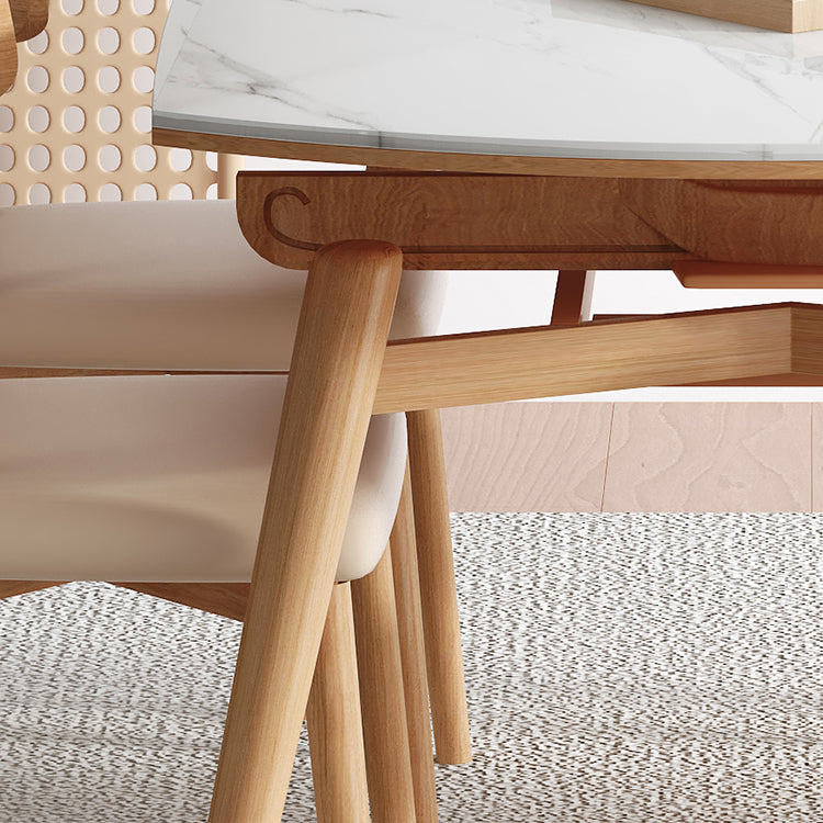 モダンな丸いダイニングテーブル白い木の脚と白い石の卓上