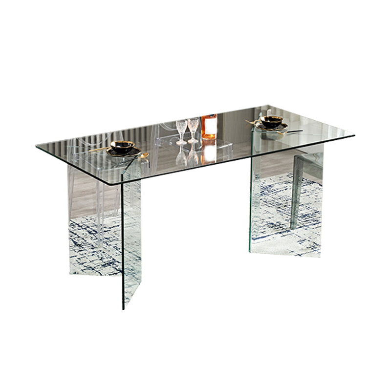 Moderne rechthoekige eettafel met glazen blad en dubbel voetstuk