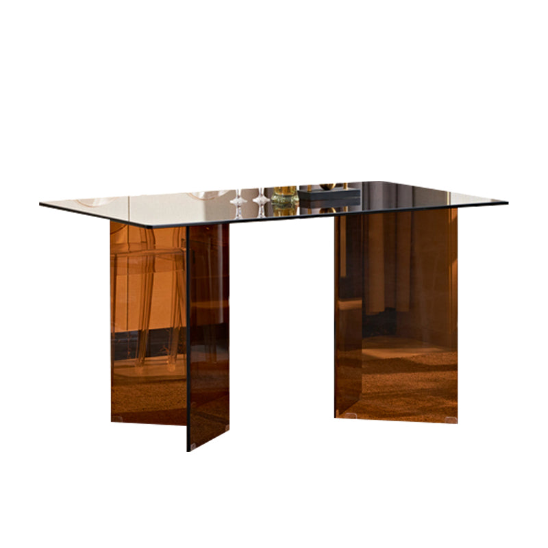 Moderne rechthoekige eettafel met glazen blad en dubbel voetstuk