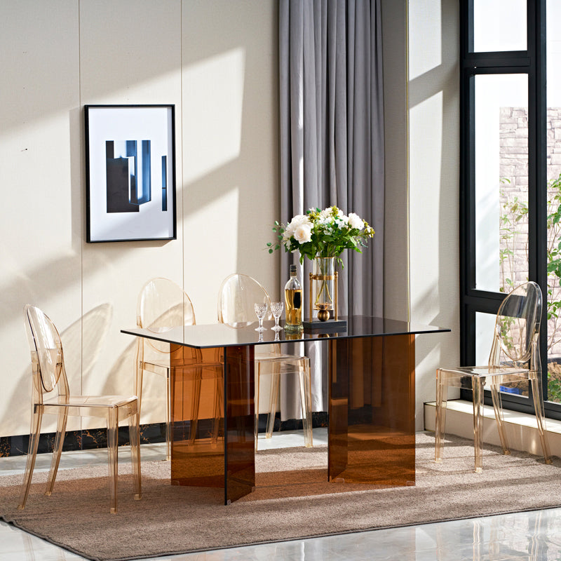 Moderne rechthoekige eettafel met glazen blad en dubbel voetstuk