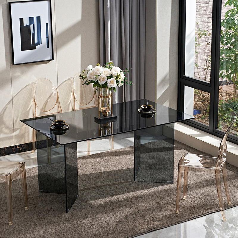 Moderne rechthoekige eettafel met glazen blad en dubbel voetstuk