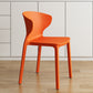 Contemporary Indoor Plastic Wingback Stackable Armless Dining Side Chair Orange 1 Piece Clearhalo 'Dining Chairs' 'Dining Tables & Seating' 'dining_chair' 'furn' 'furn_dining_chair' 'Furniture' 'Kitchen & Dining Furniture' 7718180