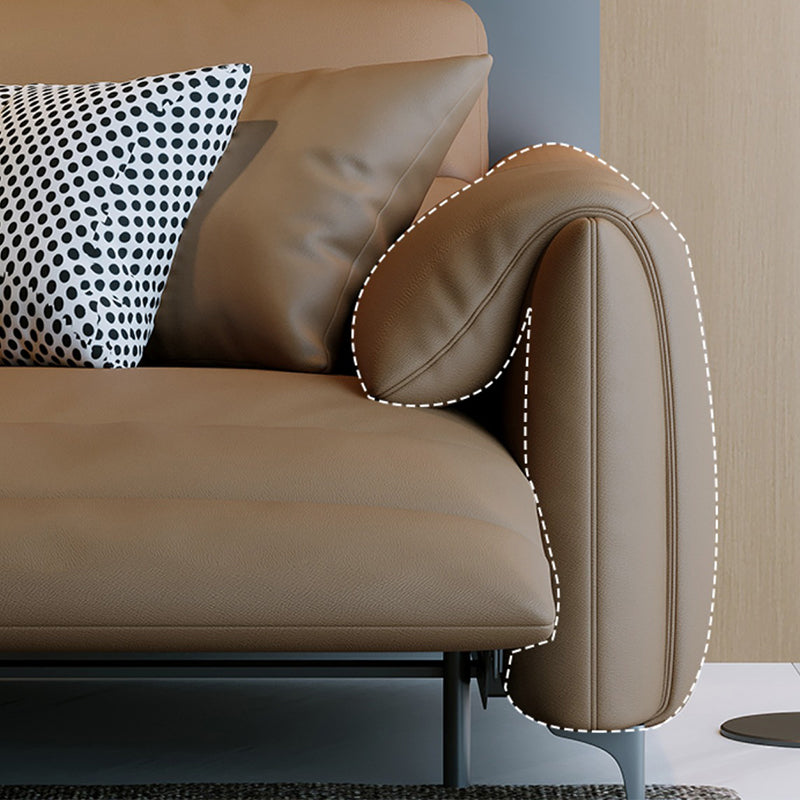 本革の枕のトップアームパワー - リビングルームにモダンなソファを押してください