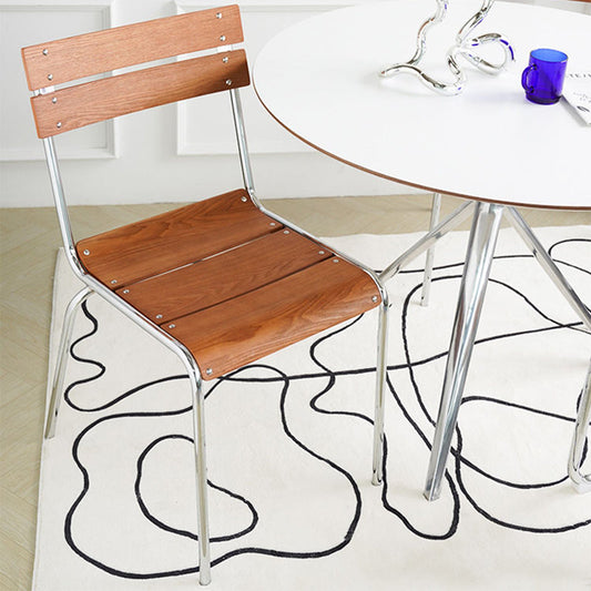 Comedor sillón de comedor sin brazo de pierna plateada contemporánea