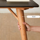 Table de salle à manger rectangulaire moderne avec plateau en pierre noire et 4 pieds en bois massif