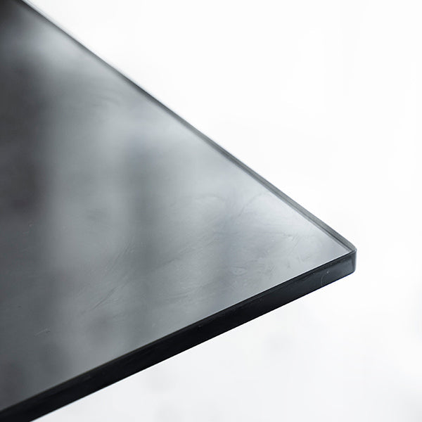 Tavolo da pranzo rettangolare in vetro rettangolare contemporaneo con gambe in acciaio