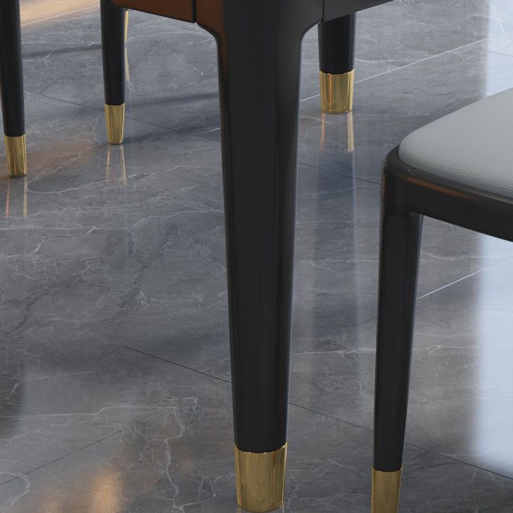 Luxe ronde grijze stenen topverlenging eettafel met 4 zwarte en gouden poten