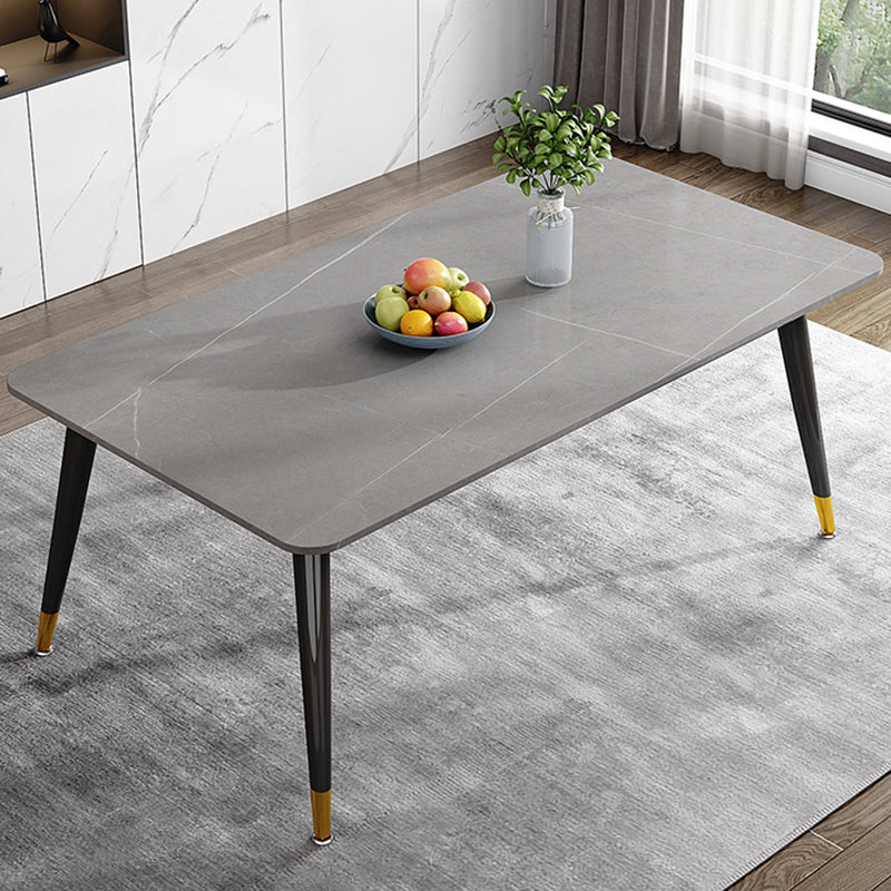 Mesa de comedor de piedra rectangular de lujo con 4 patas de acero dorado y negro