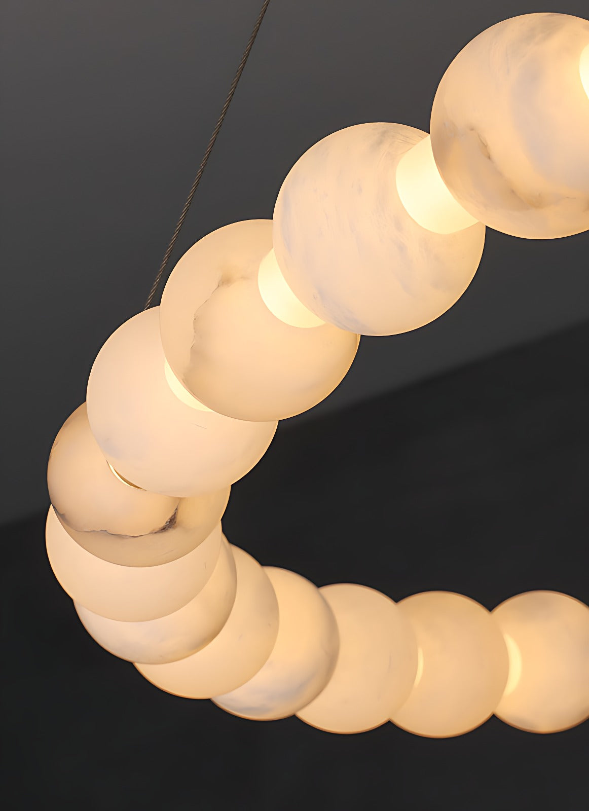 Alabaster Bead Ring Chandelier, Single, Double and Triple Rings – curve of lit alabaster beads, warm translucency and grain