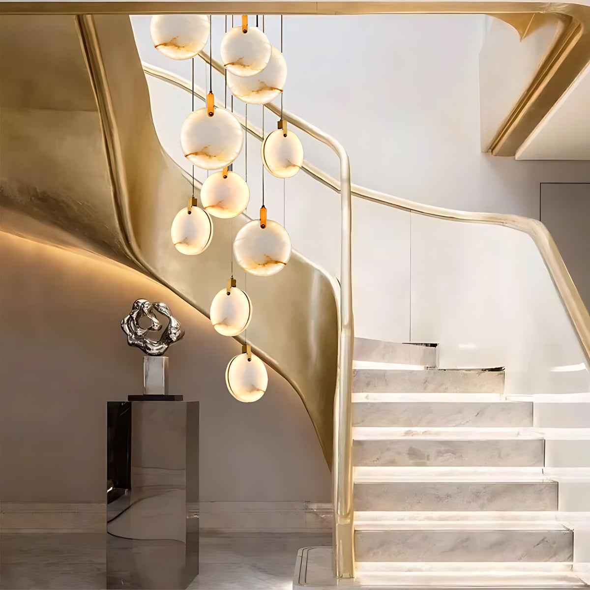 Alabaster Disc Pendant Light, Single or Stair Cluster up to 15 Lights – lit stair cluster beside a marble staircase