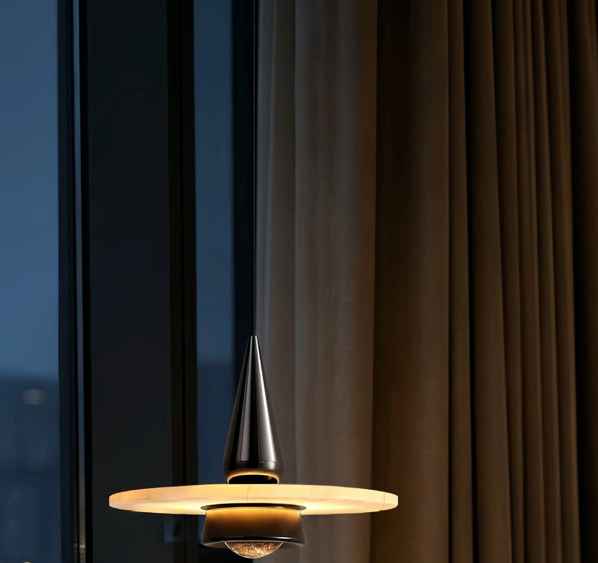 Alabaster Disc Pendant Light with Black Cone Body, Fixed or Lift Cord – lit pendant at dusk by a window and curtains