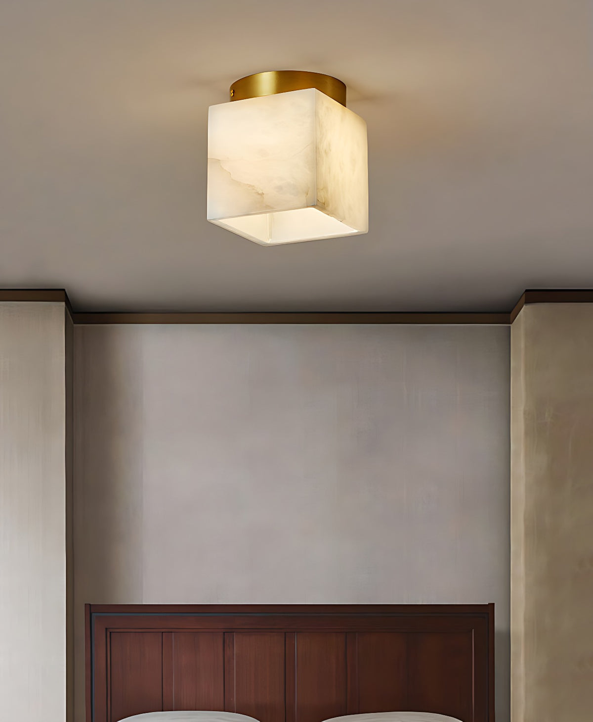 Small Alabaster Cube Flush Mount Light with Solid Brass Canopy – cube flush mount on bedroom ceiling above a wooden headboard