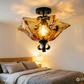 Black Flower Semi Flush Light Traditionalism Amber Glass 3 Lights Living Room Ceiling Lighting Clearhalo 'Ceiling Lights' 'Close To Ceiling Lights' 'Close to ceiling' 'Glass shade' 'Glass' 'Semi-flushmount' Lighting' image_337387820092684