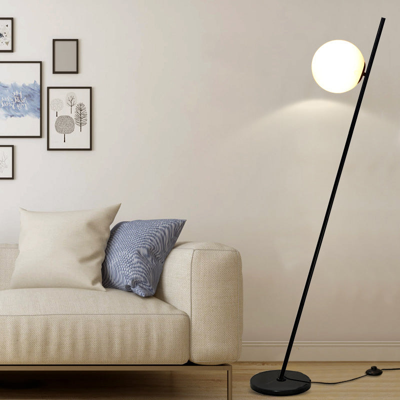 1 Light Bedroom Floor Lamp Minimalist Black Linear Standing Floor Light with Sphere Opal White Glass Shade Black Clearhalo 'Floor Lamps' 'Lamps' Lighting' 1135850