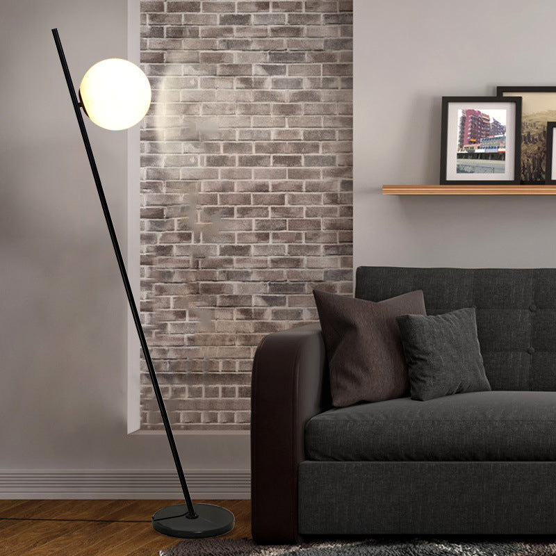 1 Light Bedroom Floor Lamp Minimalist Black Linear Standing Floor Light with Sphere Opal White Glass Shade Clearhalo 'Floor Lamps' 'Lamps' Lighting' 1135851