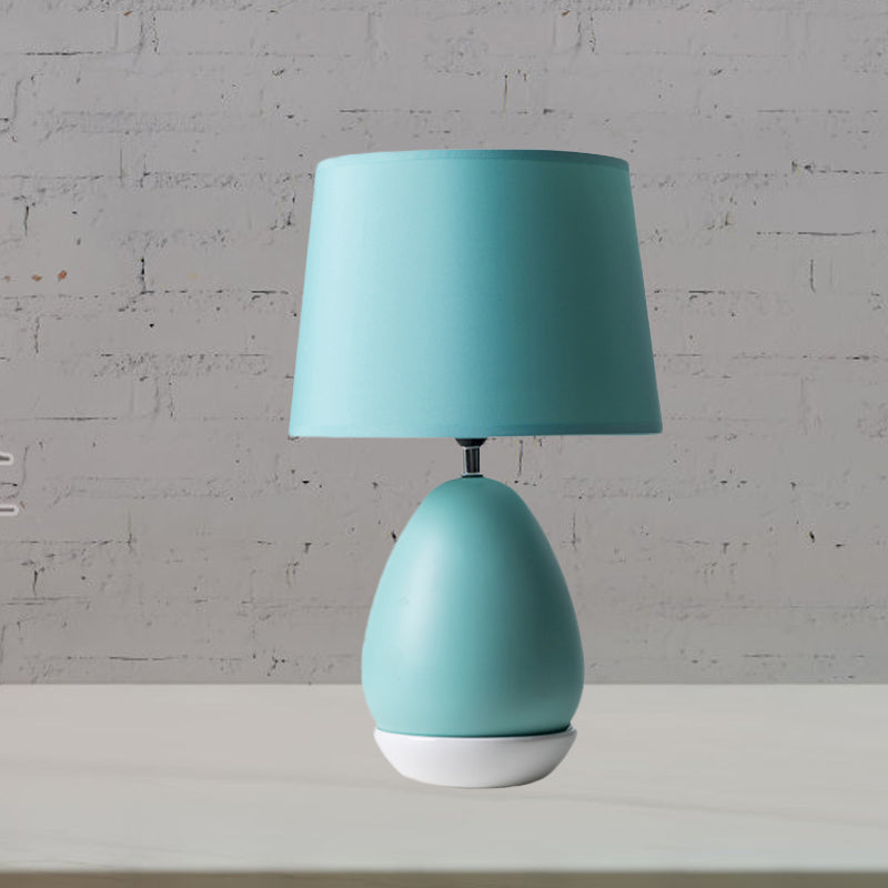 Egg-Shaped Bedside Night Light Modern Ceramic 1 Head Blue Table Stand Lamp with Drum Fabric Shade Clearhalo 'Lamps' 'Table Lamps' Lighting' 1136117