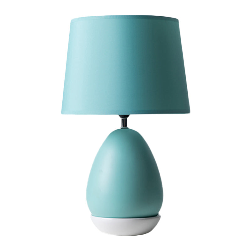 Egg-Shaped Bedside Night Light Modern Ceramic 1 Head Blue Table Stand Lamp with Drum Fabric Shade Clearhalo 'Lamps' 'Table Lamps' Lighting' 1136118