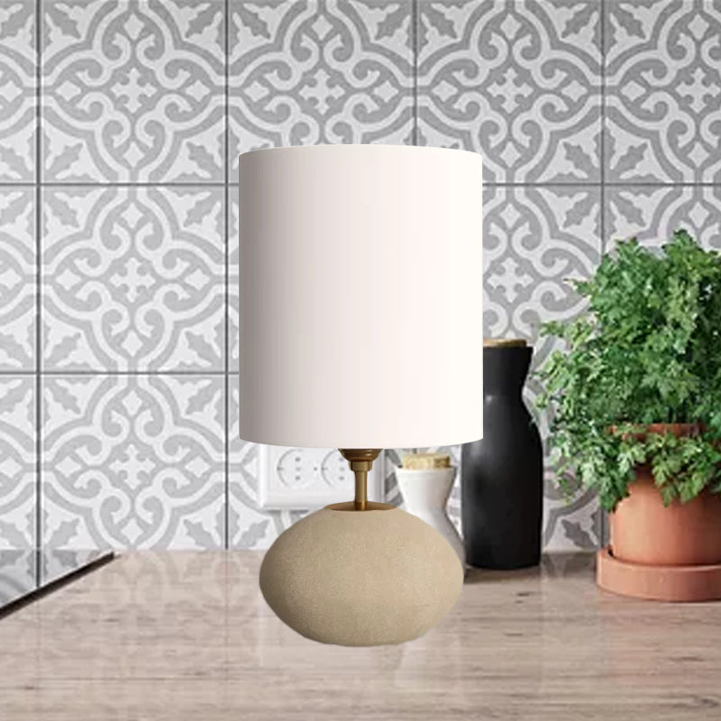 Cylindrical Fabric Table Lamp Countryside 1 Bulb Living Room Nightstand Lamp with Oval Stone Base in Light-Khaki Light Khaki Clearhalo 'Lamps' 'Table Lamps' Lighting' 1136131