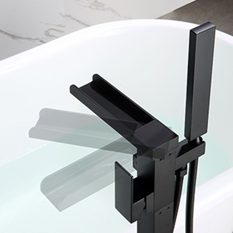 Brass Freestanding Tub Filler with Hose Floor Mounted Bathroom Faucet Clearhalo 'Bathroom Remodel & Bathroom Fixtures' 'Bathtub Faucets' 'bathtub_faucets' 'Home Improvement' 'home_improvement' 'home_improvement_bathtub_faucets' 1200x1200_77972865-8746-4261-80d1-b36b6391a072