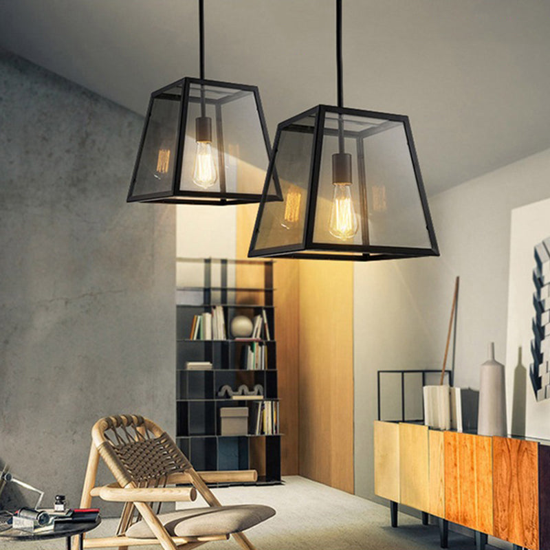 Industrial Trapezoid Pendant Lighting 1 Light Clear Glass Hanging Light Fixture in Black, 12" /14" Wide Clearhalo 'Ceiling Lights' 'Glass shade' 'Glass' 'Industrial Pendants' 'Industrial' 'Middle Century Pendants' 'Pendant Lights' 'Pendants' 'Tiffany' Lighting' 136189