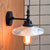 Clear/Green Glass Black Sconce Light Cone/Wide Flare 1-Light Industrial Wall Lamp Fixture for Living Room Clear Cone Clearhalo 'Cast Iron' 'Glass' 'Industrial wall lights' 'Industrial' 'Middle century wall lights' 'Modern' 'Tiffany' 'Traditional wall lights' 'Wall Lamps & Sconces' 'Wall Lights' Lighting' 138759
