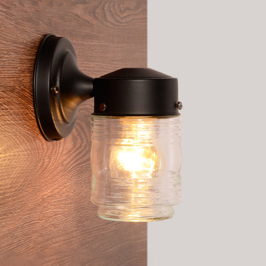 Cylindrical Clear Glass Wall Sconce Modern 1 Light Black/White Wall Mounted Light Fixture Black Clearhalo 'Cast Iron' 'Glass' 'Industrial' 'Modern wall lights' 'Modern' 'Tiffany' 'Traditional wall lights' 'Wall Lamps & Sconces' 'Wall Lights' Lighting' 1401789