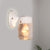 Cylindrical Clear Glass Wall Sconce Modern 1 Light Black/White Wall Mounted Light Fixture White Clearhalo 'Cast Iron' 'Glass' 'Industrial' 'Modern wall lights' 'Modern' 'Tiffany' 'Traditional wall lights' 'Wall Lamps & Sconces' 'Wall Lights' Lighting' 1401794