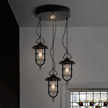 Caged Clear Glass Multi Pendant Vintage 3-Light Living Room Hanging Light Fixture in Black with Round Canopy Black Clearhalo 'Ceiling Lights' 'Glass shade' 'Glass' 'Industrial Pendants' 'Industrial' 'Middle Century Pendants' 'Pendant Lights' 'Pendants' 'Tiffany' Lighting' 141078