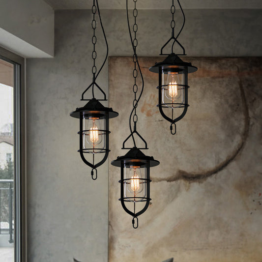 Caged Clear Glass Multi Pendant Vintage 3-Light Living Room Hanging Light Fixture in Black with Round Canopy Clearhalo 'Ceiling Lights' 'Glass shade' 'Glass' 'Industrial Pendants' 'Industrial' 'Middle Century Pendants' 'Pendant Lights' 'Pendants' 'Tiffany' Lighting' 141079