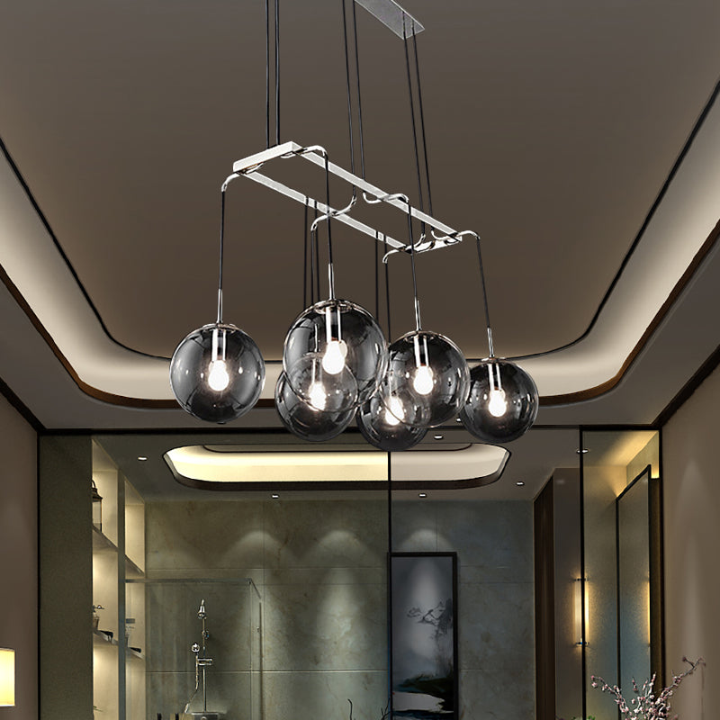 Black Ball Multi Pendant Industrial Clear Closed Glass 6-Light Indoor Hanging Ceiling Light with Linear Canopy Smoke Gray Clearhalo 'Ceiling Lights' 'Glass shade' 'Glass' 'Industrial Pendants' 'Industrial' 'Middle Century Pendants' 'Pendant Lights' 'Pendants' 'Tiffany' Lighting' 141413