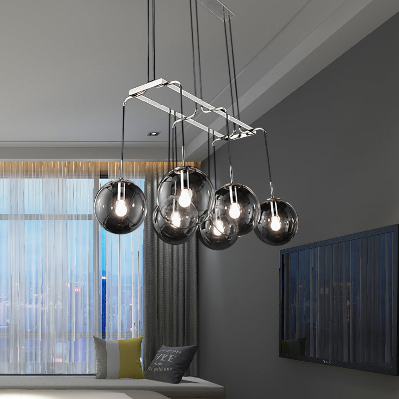 Black Ball Multi Pendant Industrial Clear Closed Glass 6-Light Indoor Hanging Ceiling Light with Linear Canopy Clearhalo 'Ceiling Lights' 'Glass shade' 'Glass' 'Industrial Pendants' 'Industrial' 'Middle Century Pendants' 'Pendant Lights' 'Pendants' 'Tiffany' Lighting' 141414